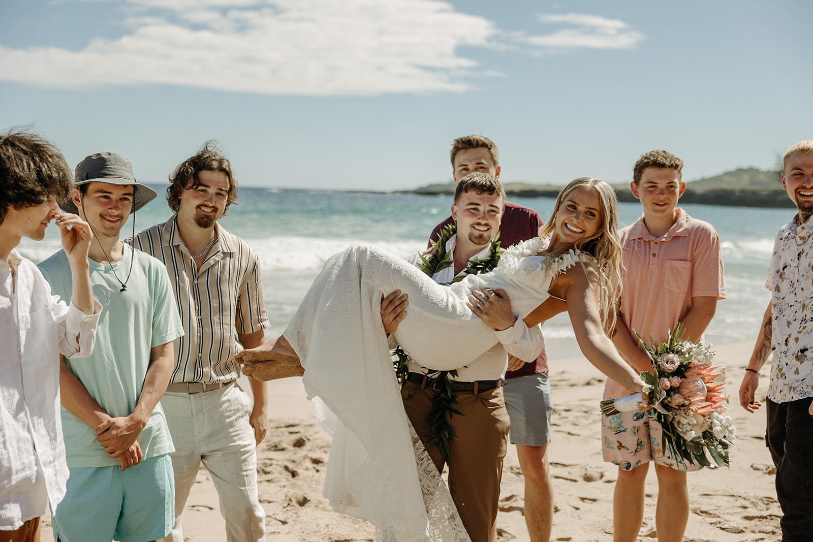 Couple eloped at the Ironwoods Beach in Maui, Hawaii wearing traditional lei