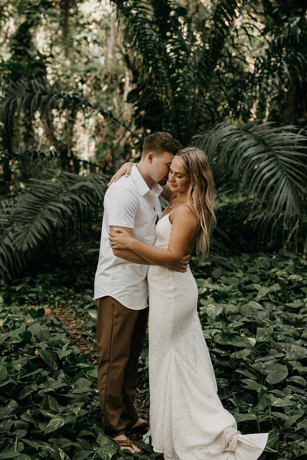 Couple who eloped in Maui, Hawaii exploring the Enchanted Forest at Honolua Bay