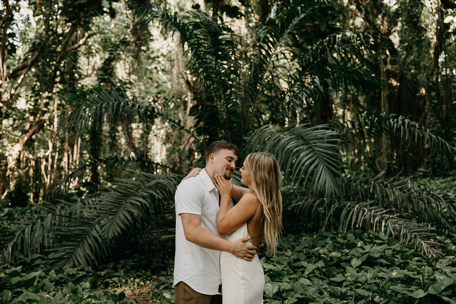 Couple who eloped in Maui, Hawaii exploring the Enchanted Forest at Honolua Bay
