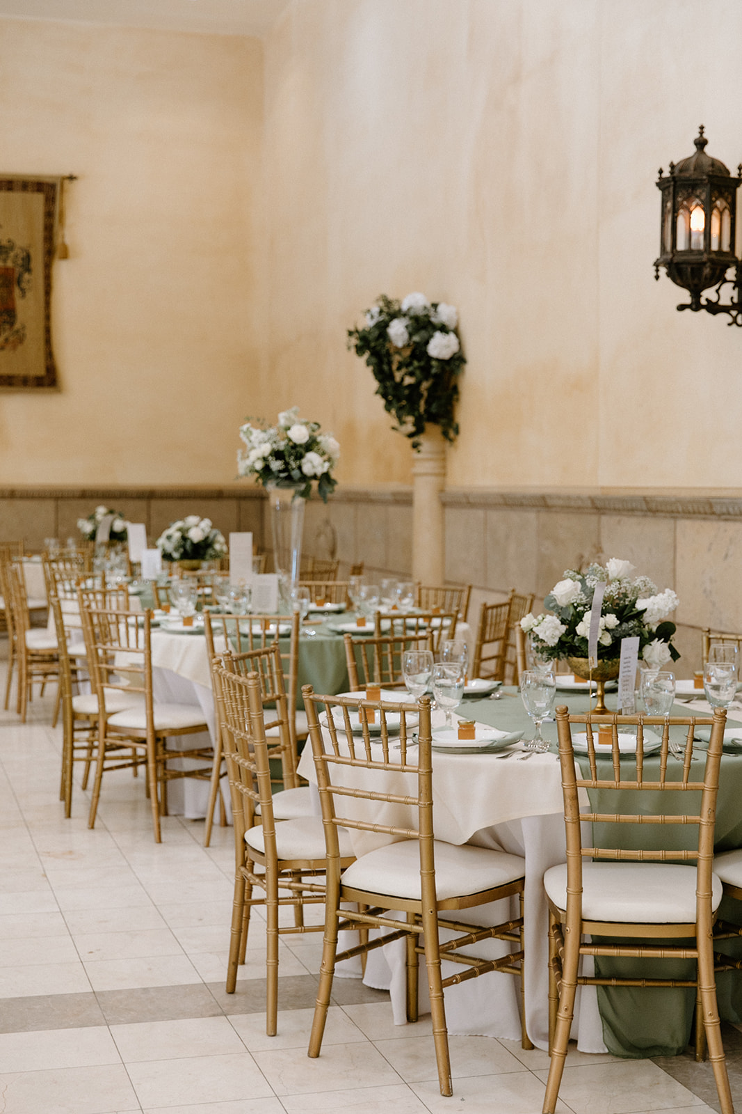 The Ashley Castle Arizona venue featuring sage wedding table setting