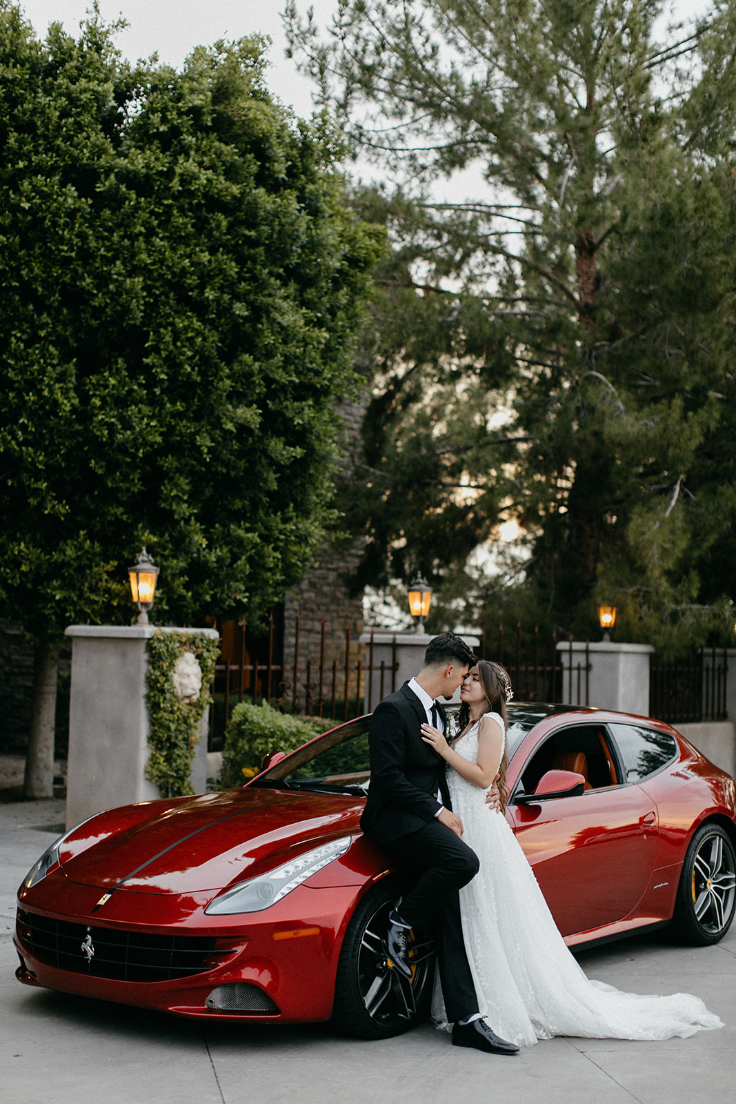 The Ashley castle chandler bride and groom posing with car