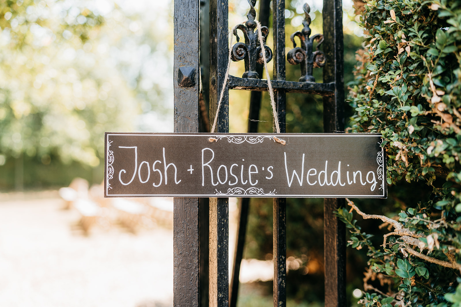 A sign with the bride and grooms name
