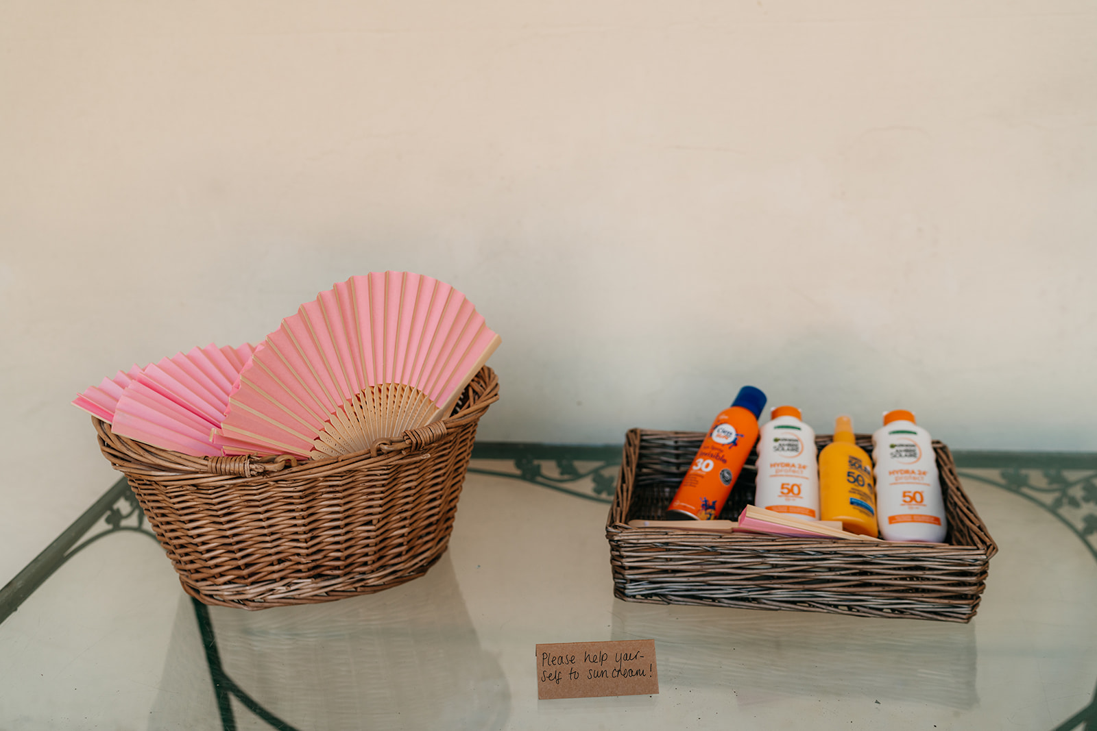 Wedding details. Fans and suncream ready for a warm wedding day here in the UK