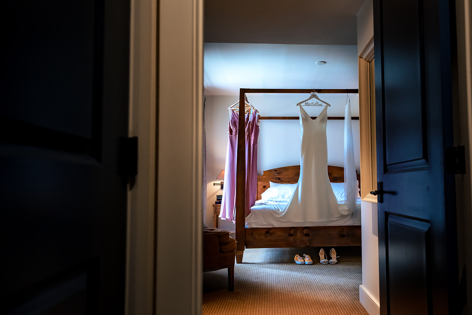 wedding dress hanging in Vermont hotel room