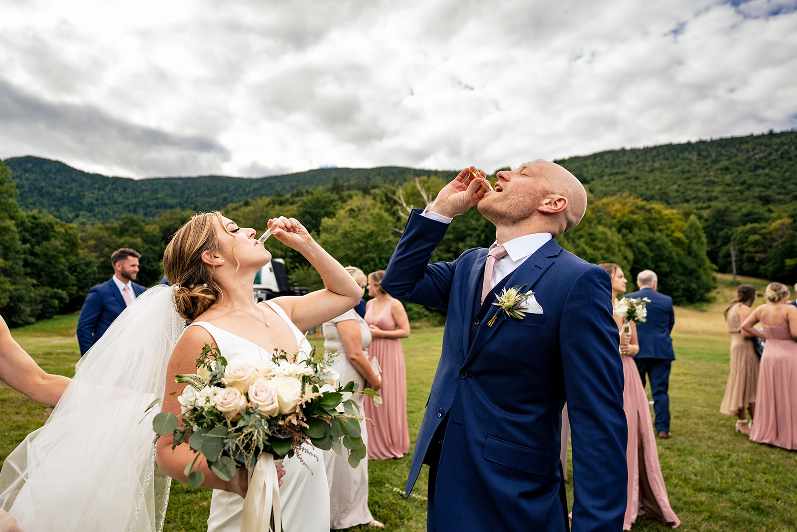 bride and groom taking a shot after their Vermont wedding ceremony