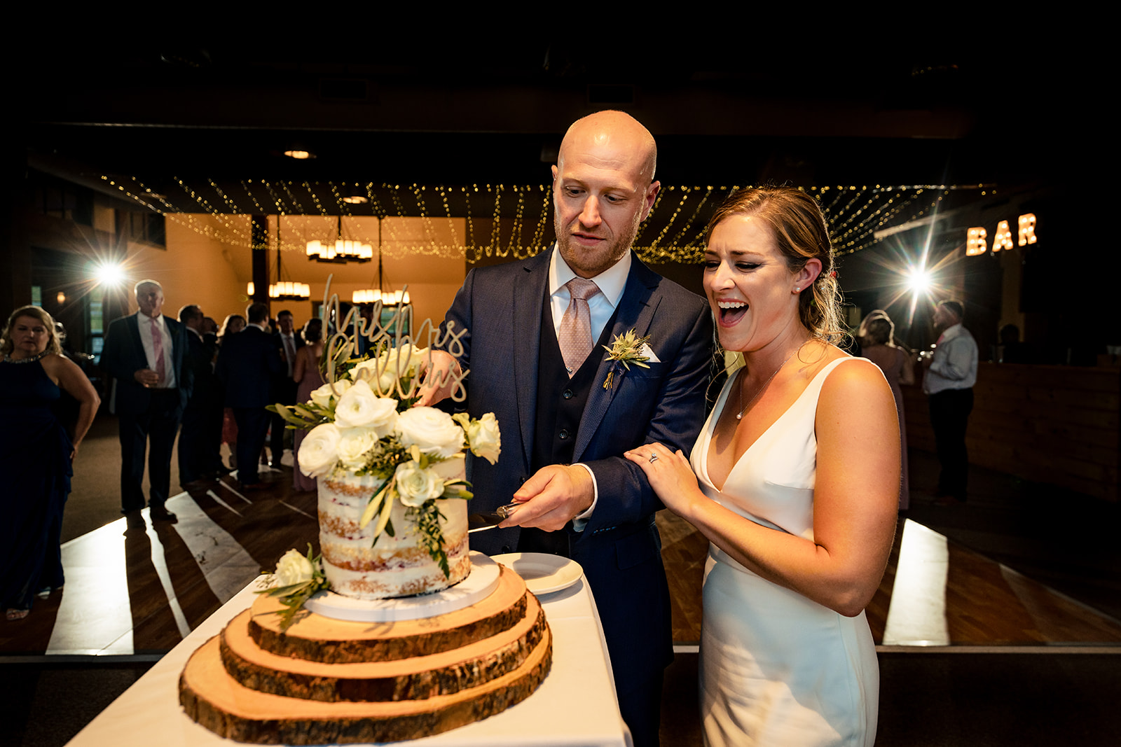bride and groom cutting their cake at Sugarbush Resort in Vermont