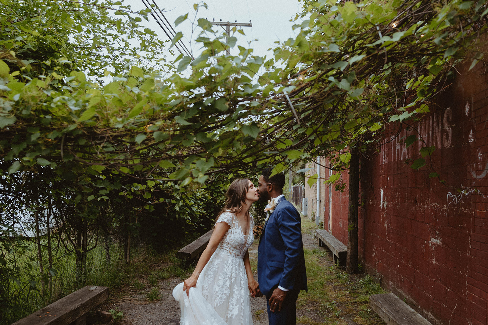 Bride and Groom share a kiss outside Jam Handy in Detroit, Michigan.