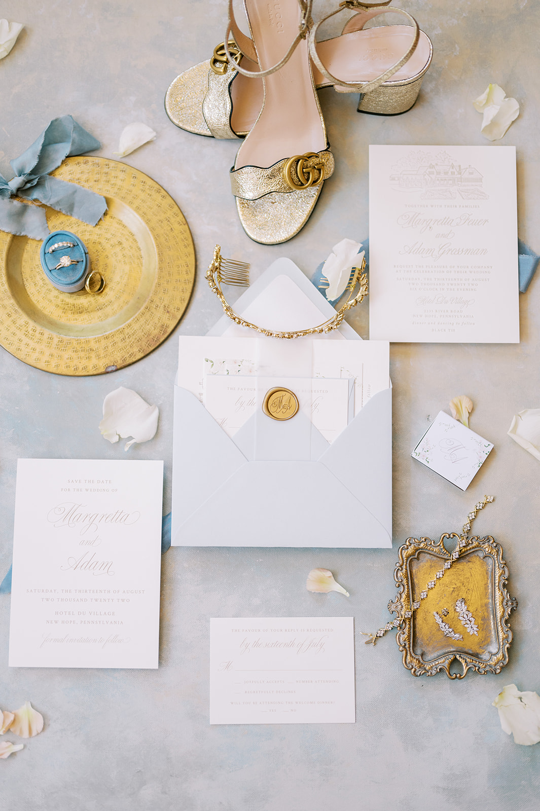 flat lay detail  with rings, bands, invitation suite,  gucci shoes 