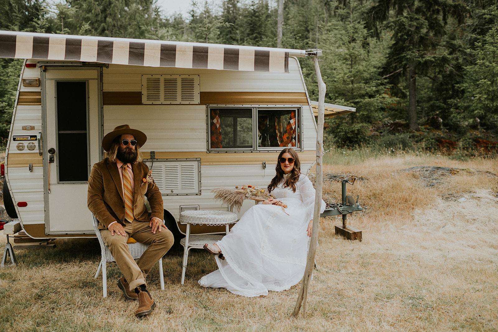 bride and groom outside of retro camper