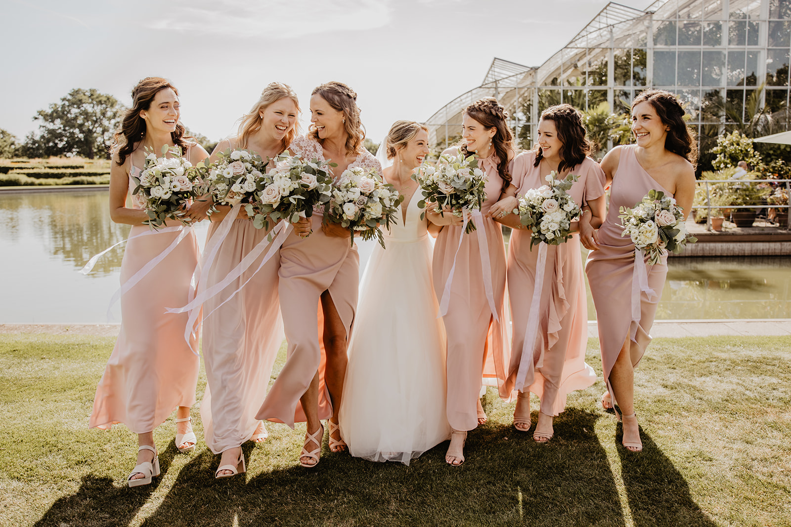 Bride and bridesmaids at a RHS Gardens Wisley Wedding. By Olive Joy Photography