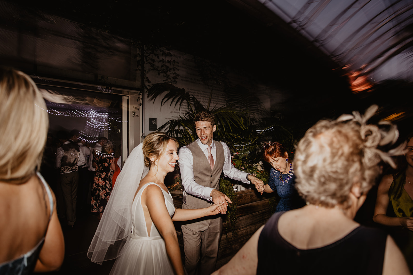 Bride and groom dancing at a RHS Gardens Wisley Wedding. By Olive Joy Photography