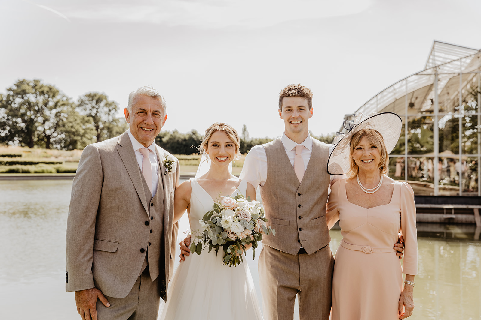 Bride, groom and family at a RHS Gardens Wisley Wedding. By Olive Joy Photography