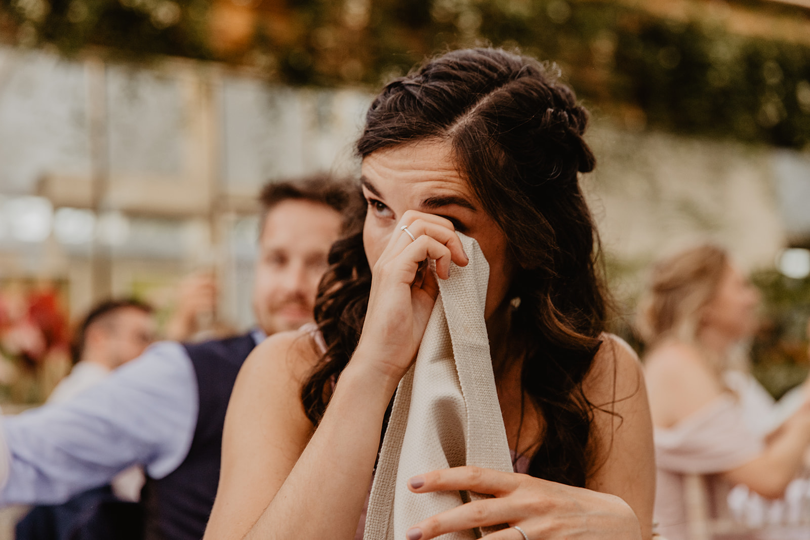 Guest crying at reception speeches at a RHS Gardens Wisley Wedding. By Olive Joy Photography