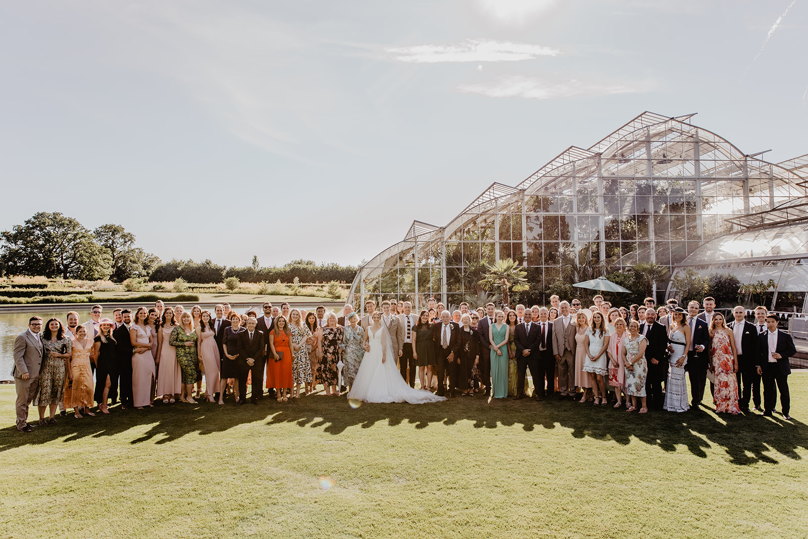 Guests group shot at a RHS Gardens Wisley Wedding. By Olive Joy Photography
