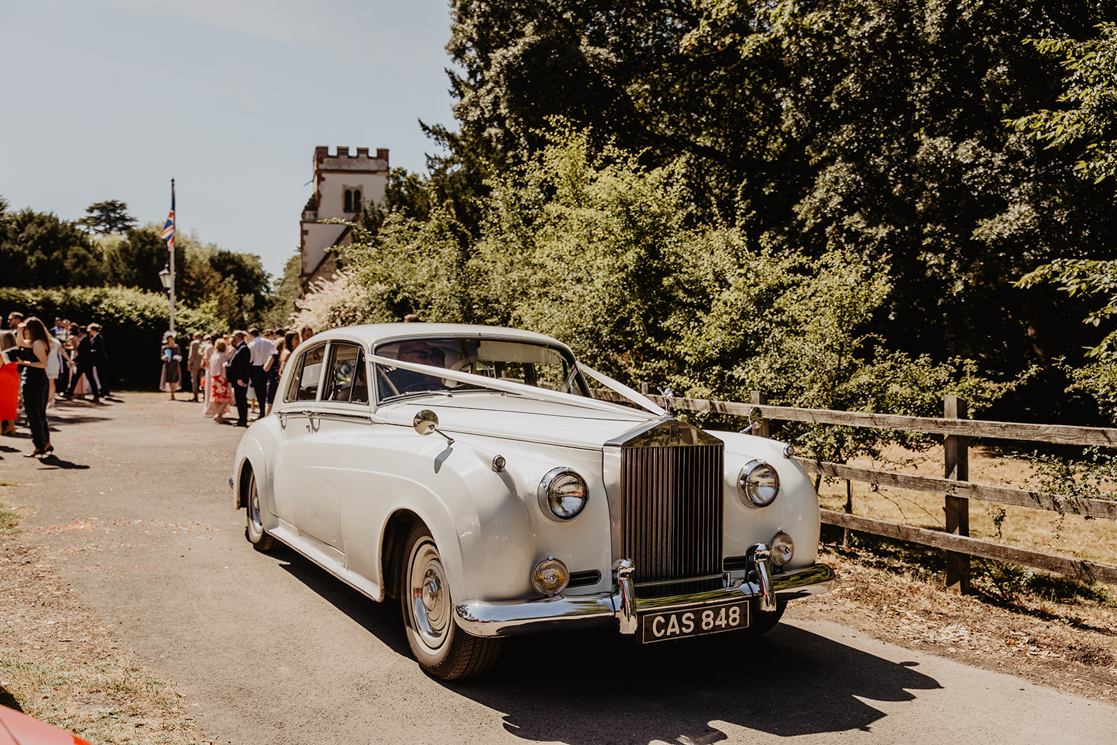 Wedding car arriving at an RHS Gardens Wisley Wedding. By Olive Joy Photography