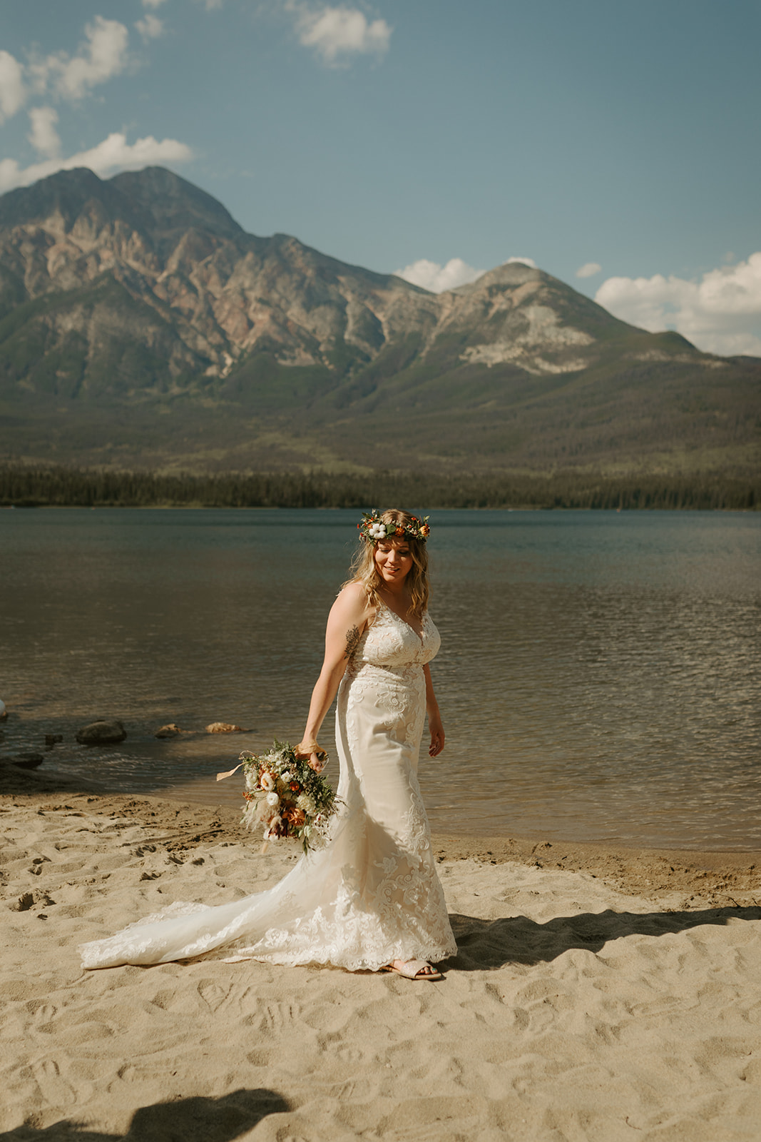 Bride on beach at pyramid lake in Alberta