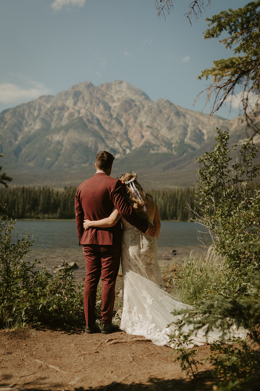 Bride and groom looking over Pyramid mountain