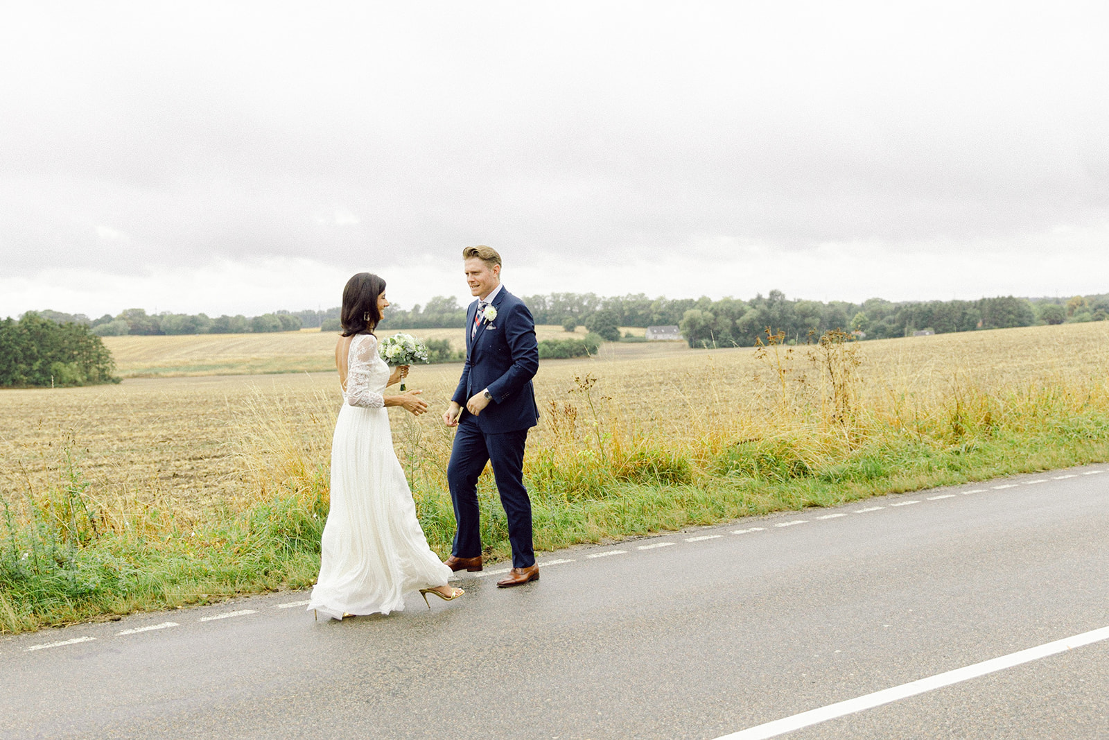 At the heart of Denmark, a Danish-American couple finds their forever love.  Walking on a road freely and happy.
