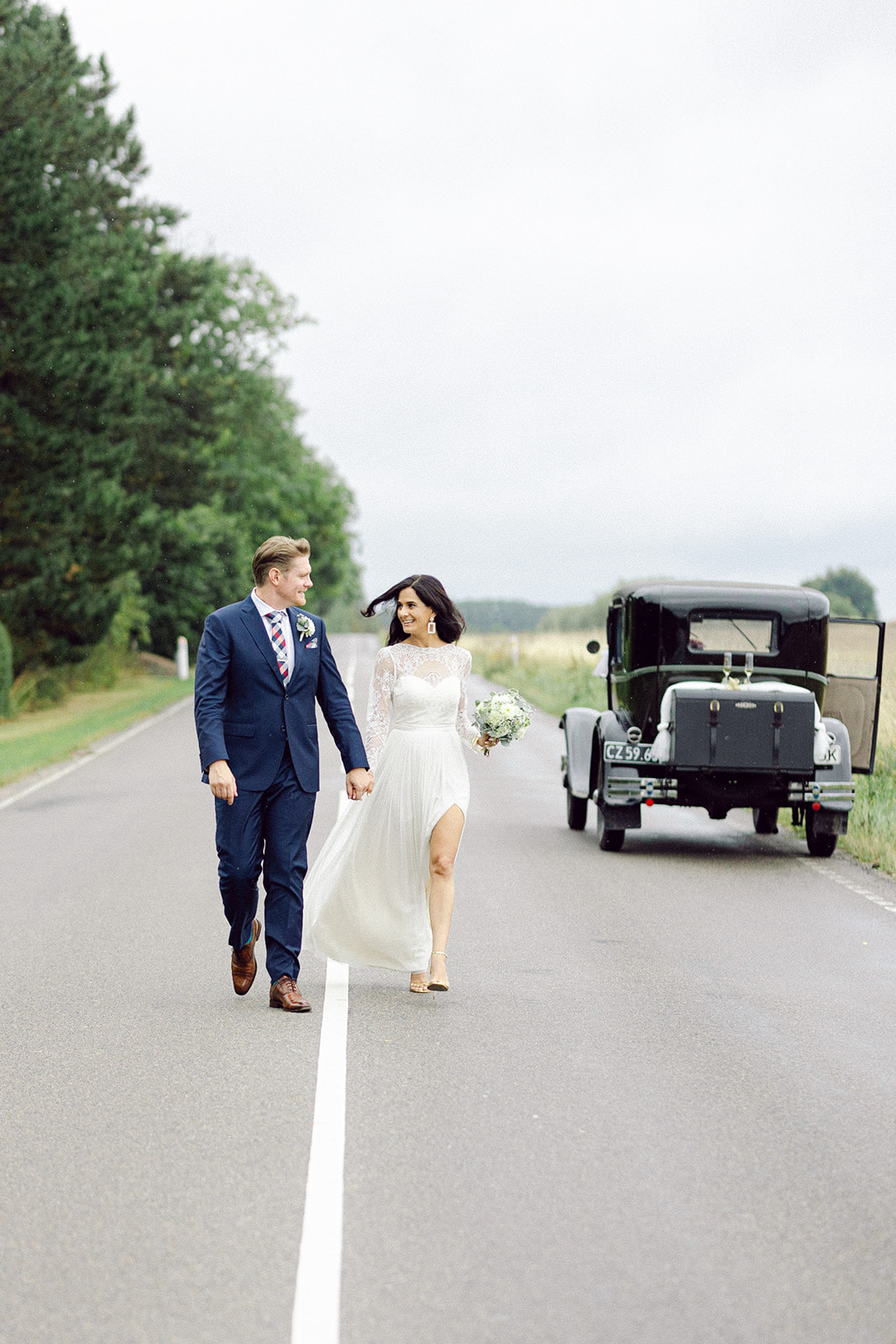 At the heart of Denmark, a Danish-American couple finds their forever love.  Walking on a road freely and happy.