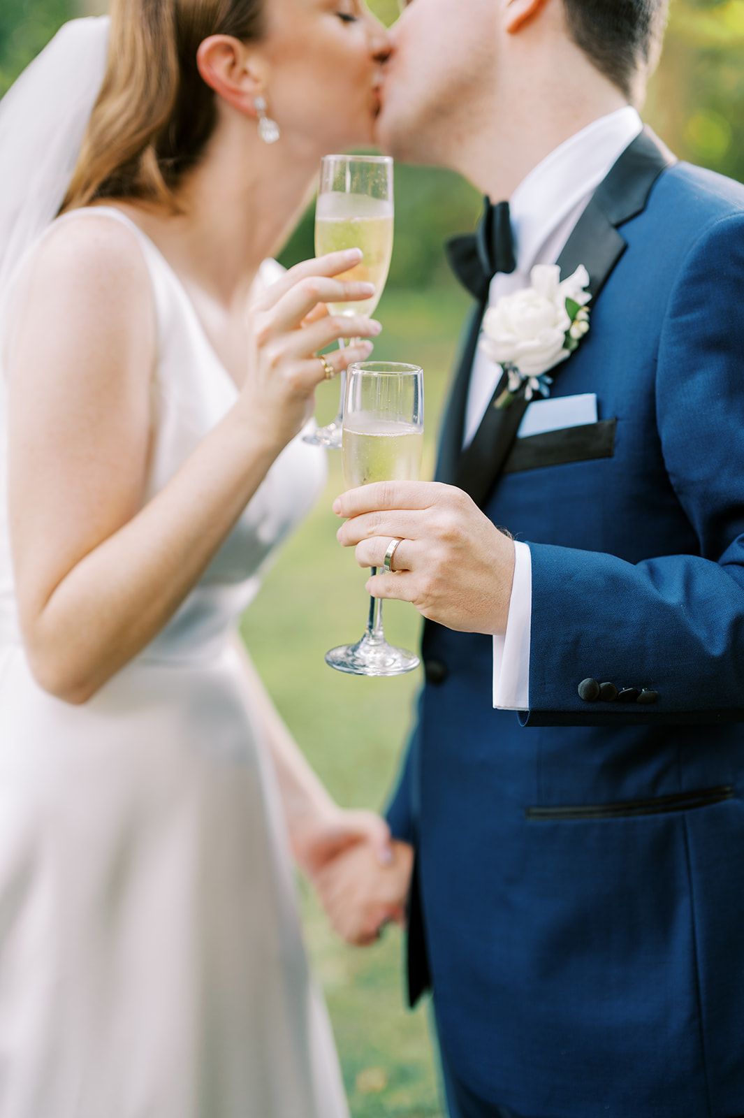 bride and groom celebrate with a cheers at Timeless Garden Wedding at Historic Glen Foerd Estate in Philadelphia, PA