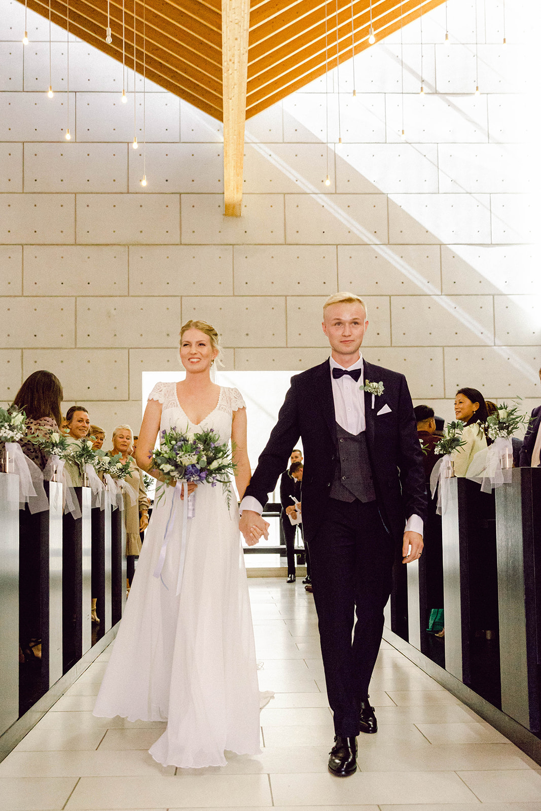 bride and groom exiting church in denmark aarhus