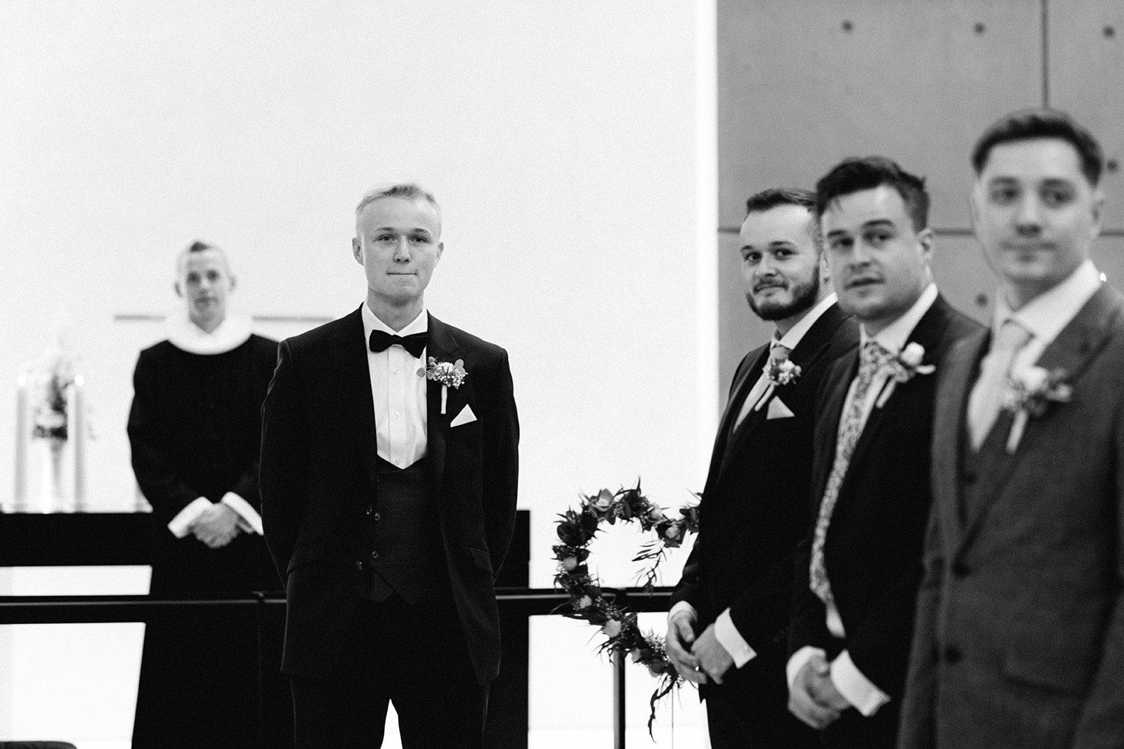 groom waiting for bride walking down the aisle