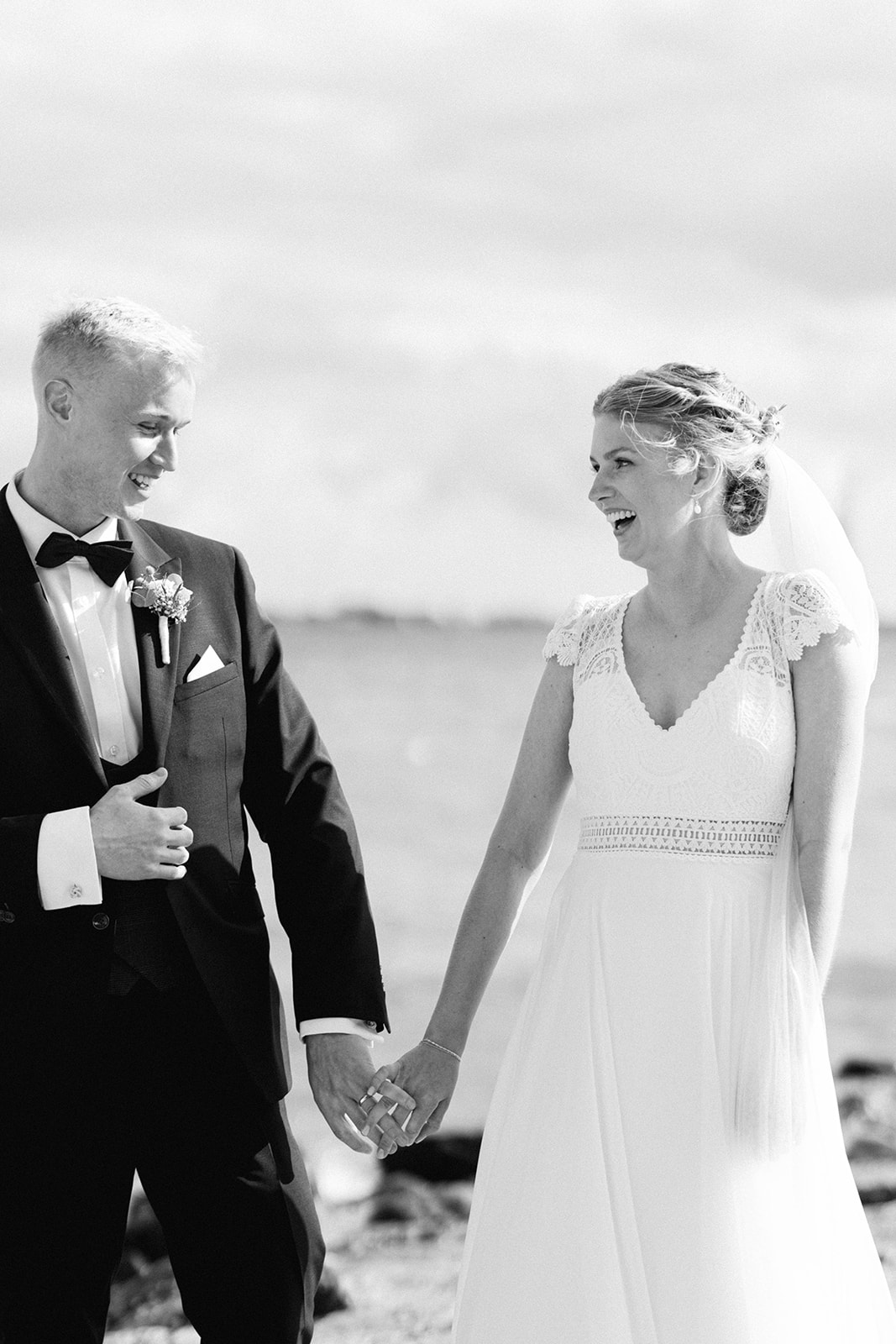 Stunning Aarhus beach wedding photo featuring happy couple