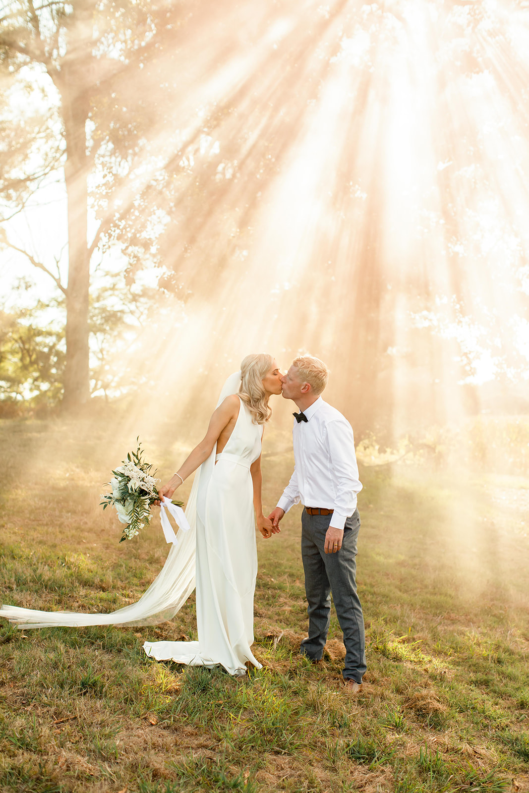 Wedding Couple in front of Sunset Streaks