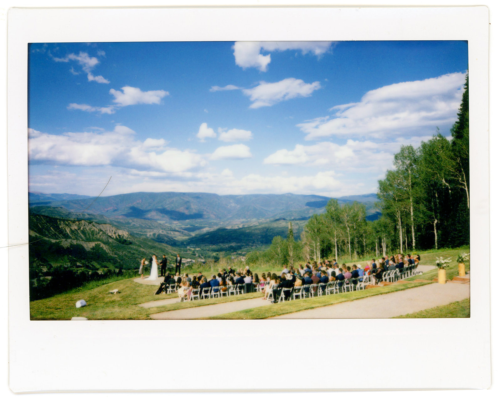 The views of the ceremony location of Limelight wedding terrace. Bird's eye view of the ceremony. Shot on polaroid.