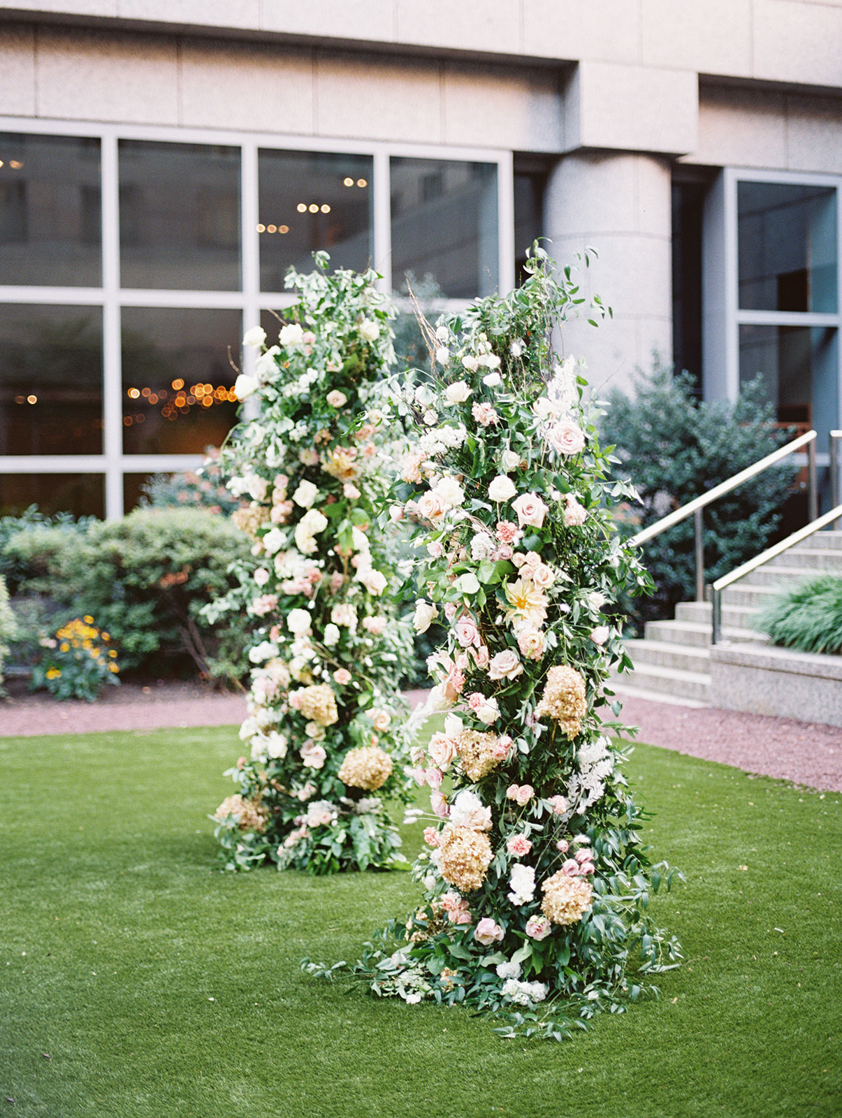 Floral pilars for a chic wedding ceremony on the lawn at the Logan in Philadelphia, PA