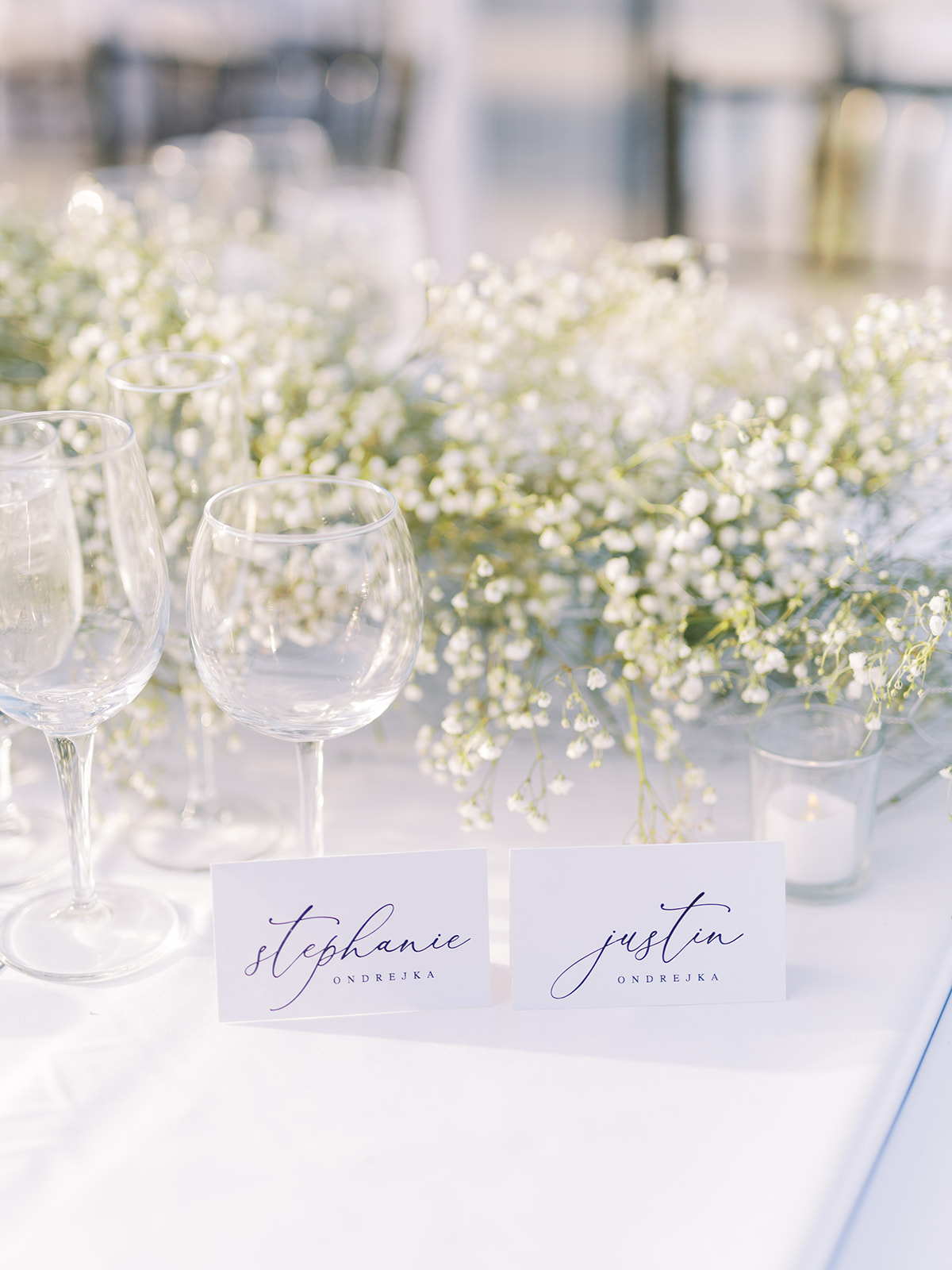 place cards for bride and groom with chic baby's breath floral arrangements for sunny summer wedding