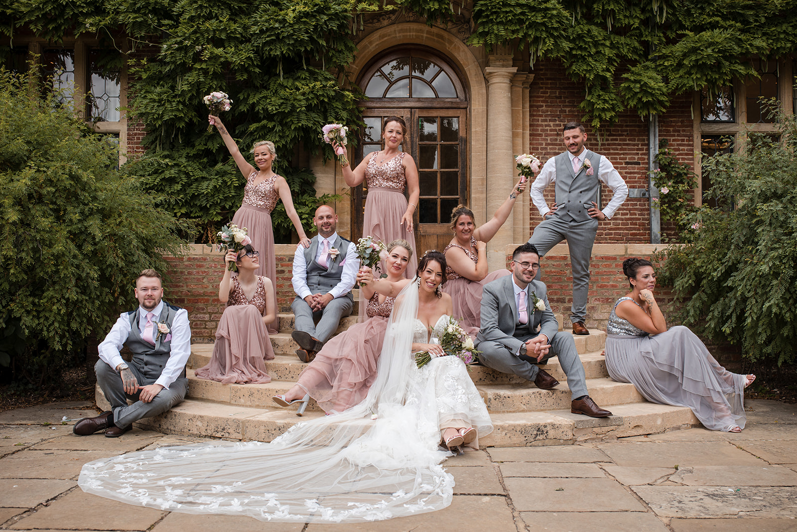 creative wedding group shot at horwood house