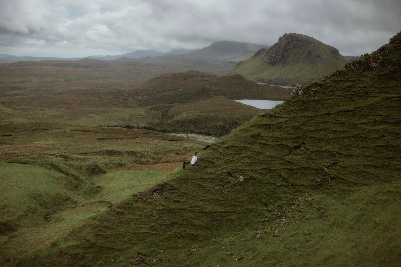 Alex and Elliot hike up to one the mountains of the Isle of Skye during their adventure session.