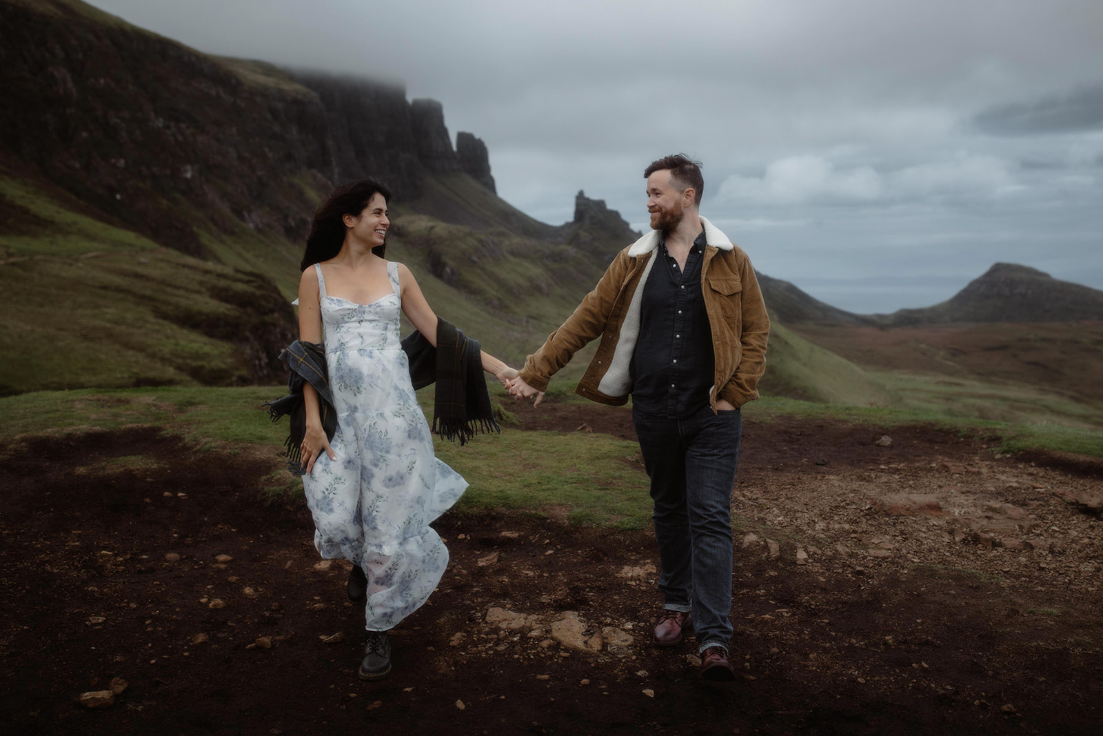 Alex and Elliot walk hand and hand while they stroll around the majestic Isle of Skye, Scotland