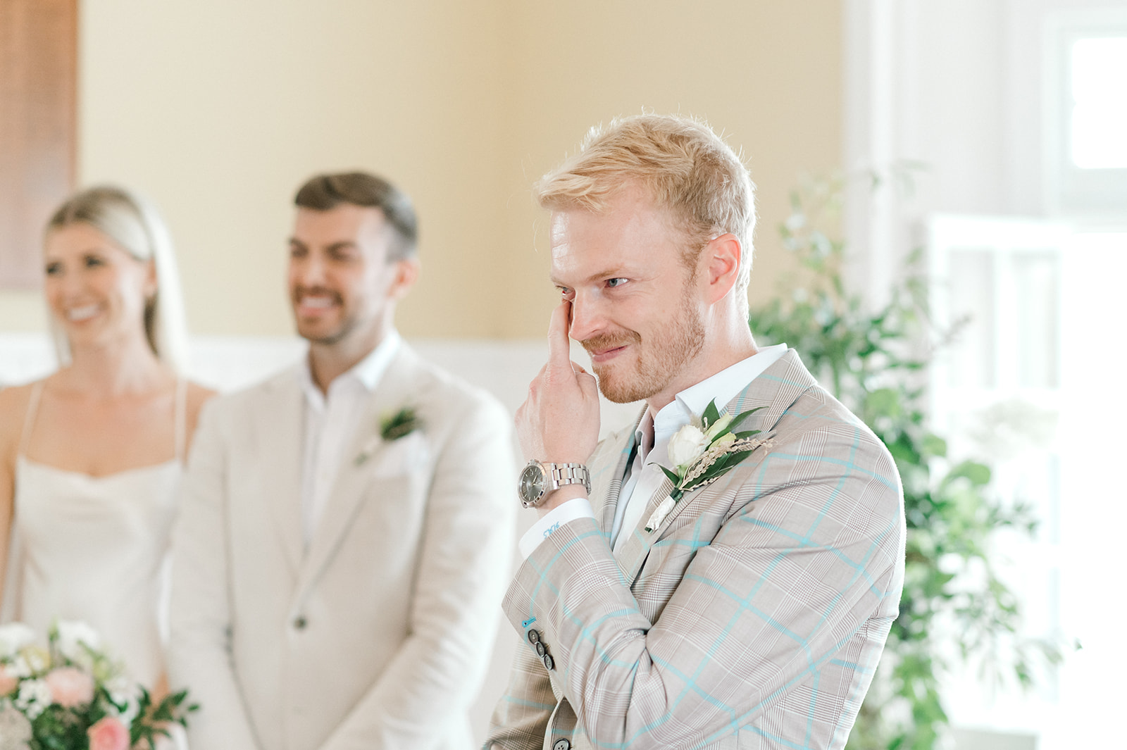 Groom sheds a tear during wedding ceremony at Muskoka Lakes Golf & Country Club in Port Carling 