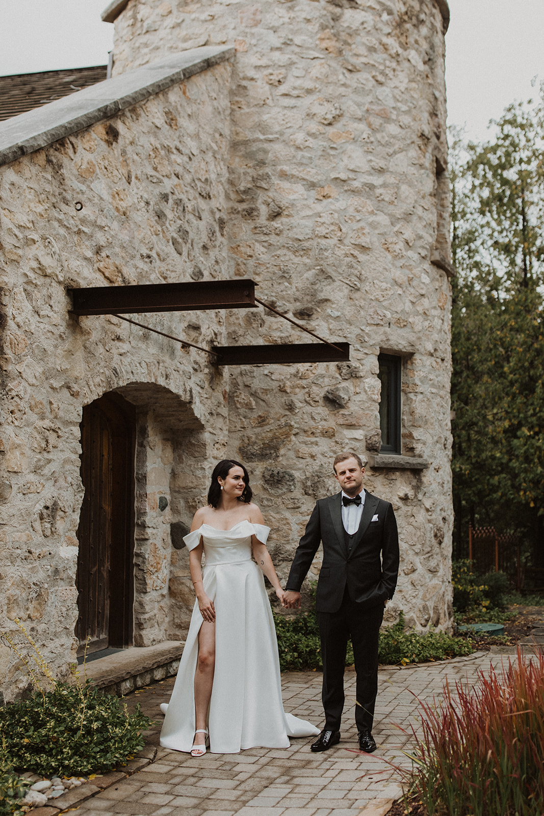 A couple say their vows in the small town of Elora amongst beautiful stone buildings.