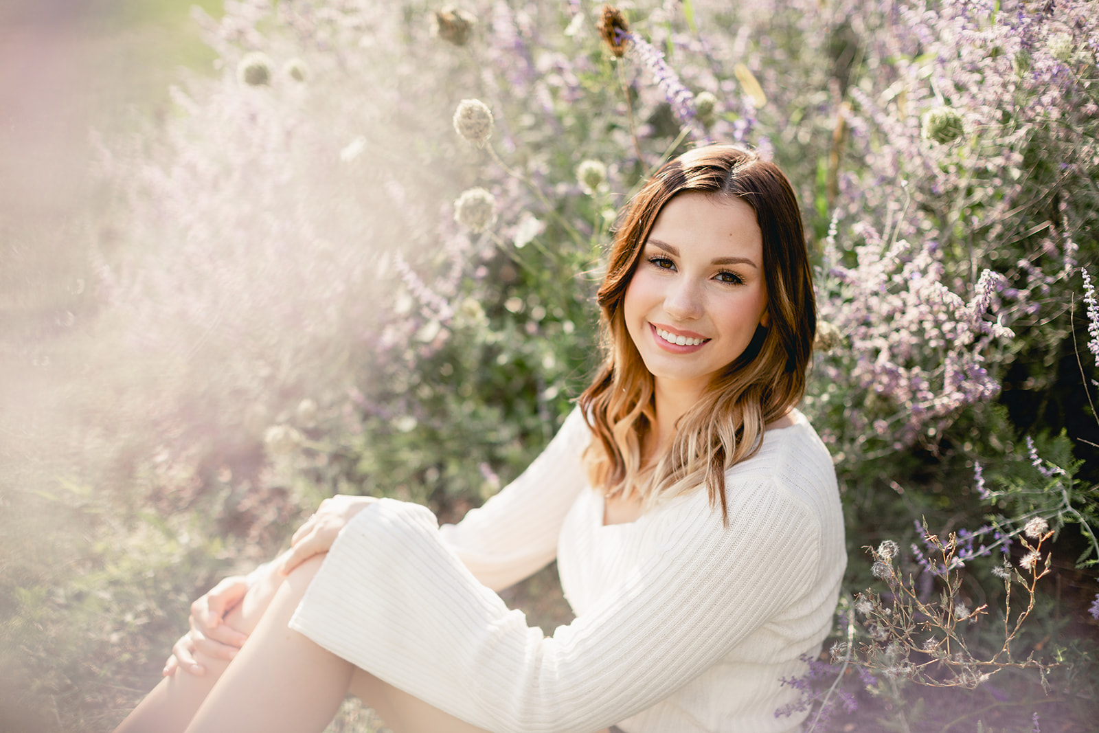 Megan in the wildflowers at Stony Creek Metropark for her senior photoshoot