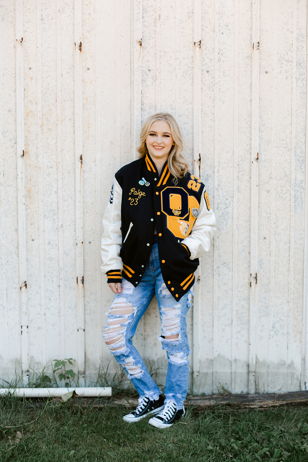 Paige wearing her letterman equestrian jacket for her senior portraits.