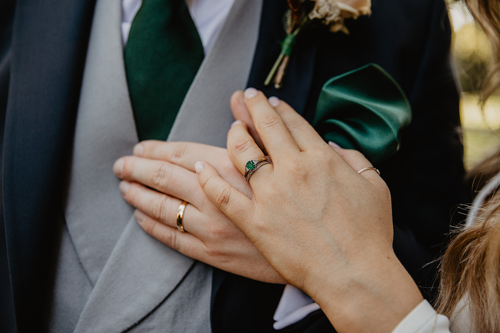 Bride and Groom hand and rings at a Hampton Court House Wedding. By Olive Joy Photography