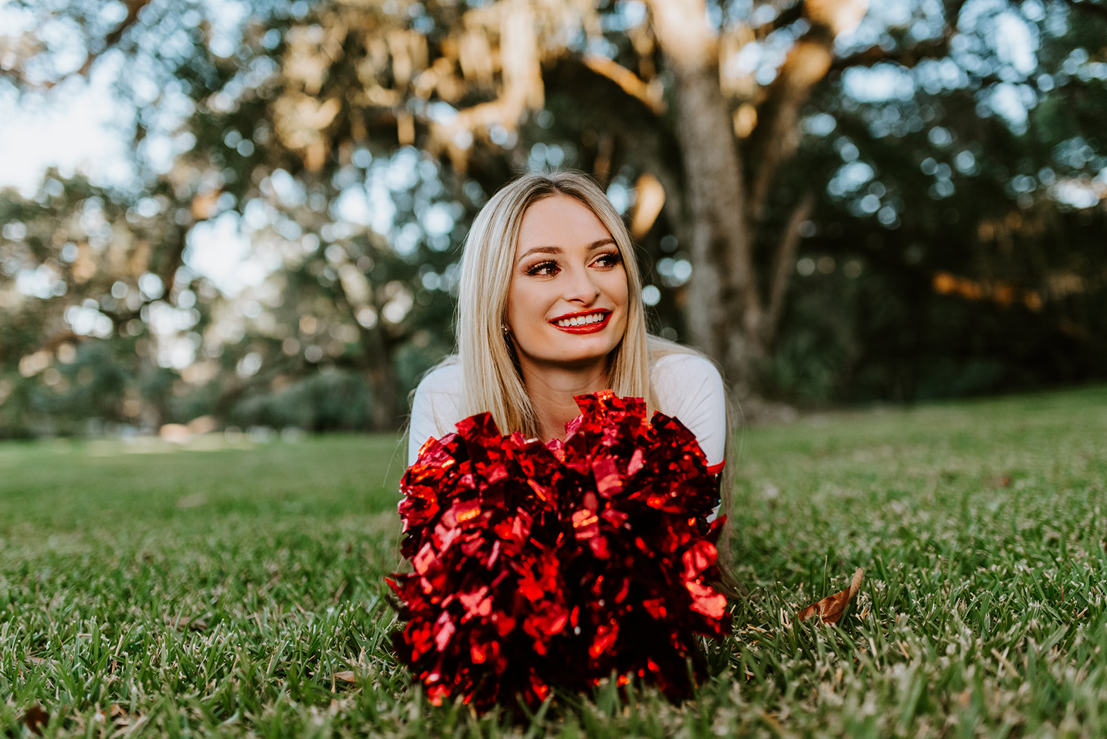 pom poms make perfect prop for senior pictures