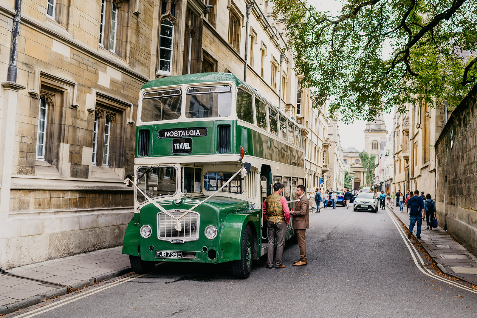 vintage bus parked outside Jesus College in Oxford city 