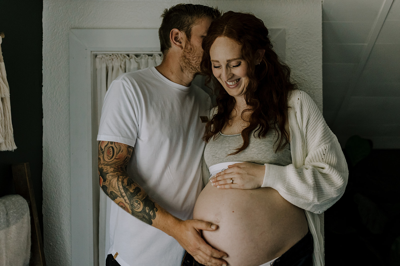 intimate moment at farmhouse maternity session