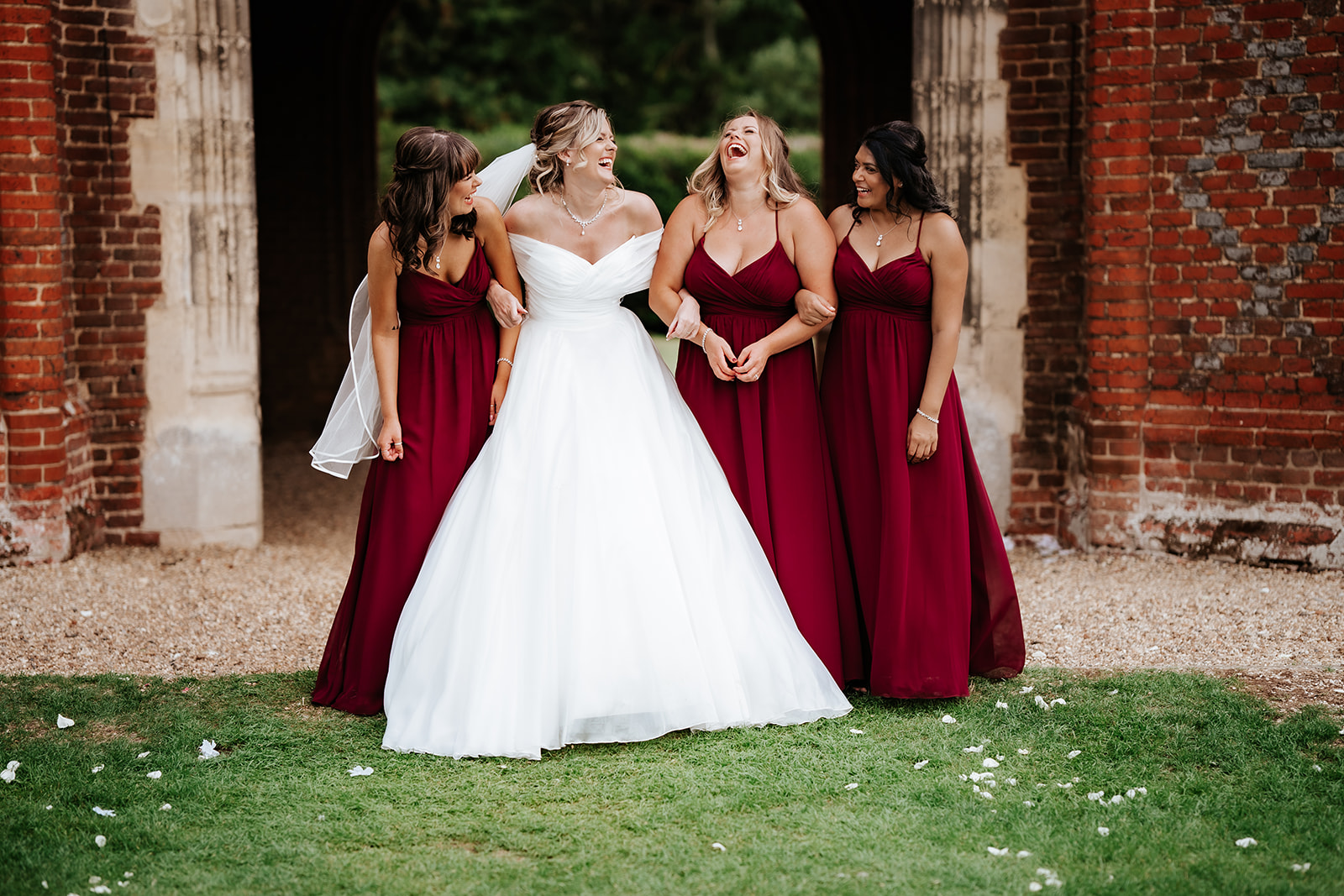 Bridal party laughing at Leez priory