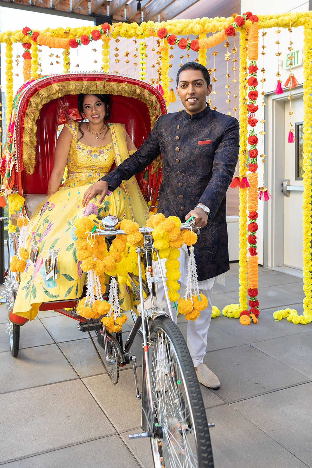 Couple poses for a photo at Hyatt Centric during their Sangreet at Hyatt Centric, a Bay Area Indian Wedding Venue.