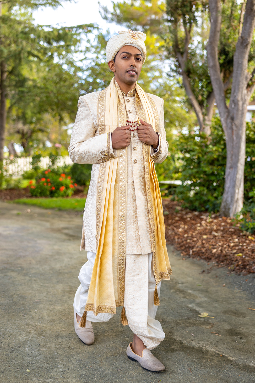 Indian wedding groom walks in his traditional clothing to Indian wedding ceremony at Rengstorff House in the Bay Area.