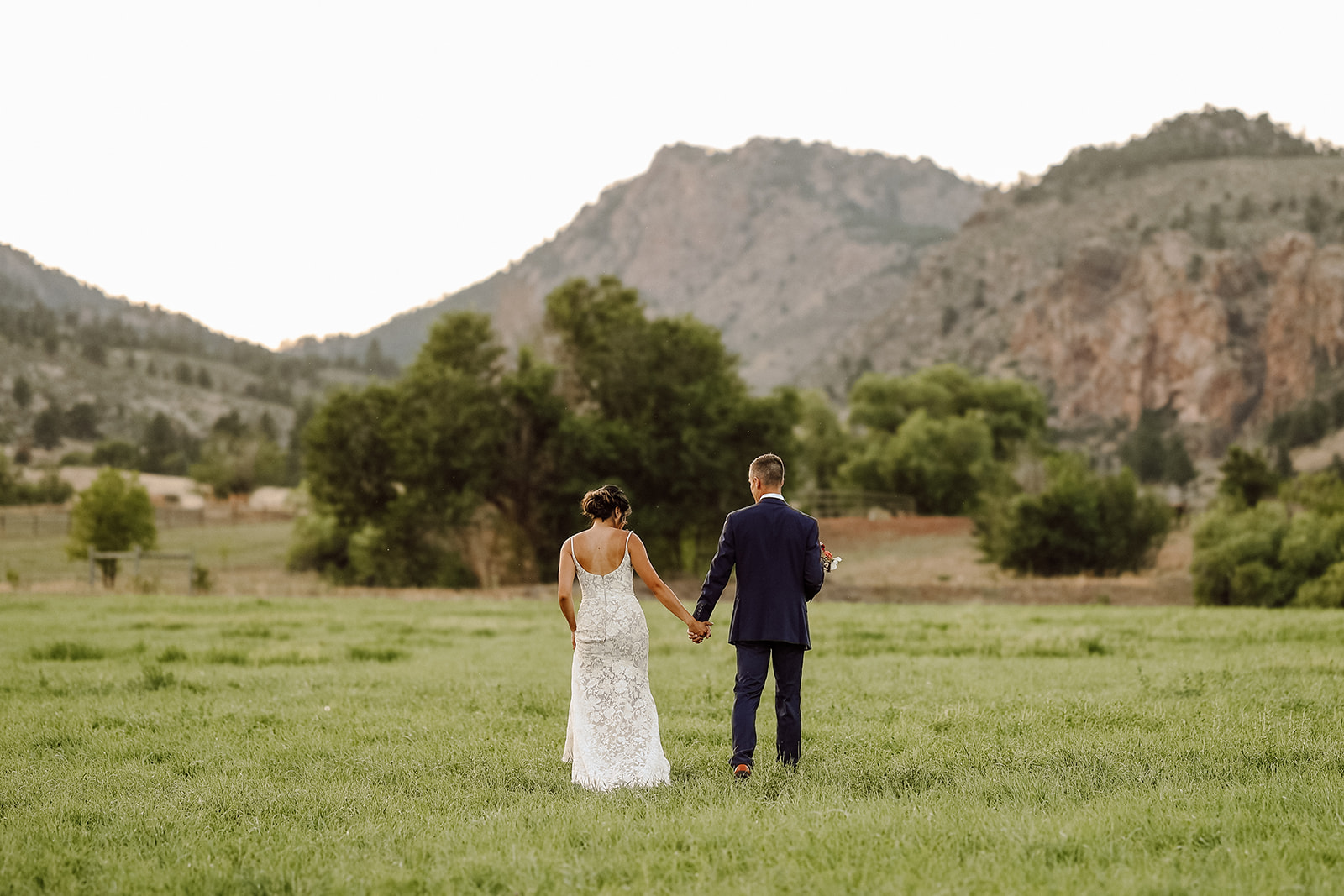 Man and woman walking along the Dale Guest Ranch for their Rocky Mountain Bride Styled Editorial
