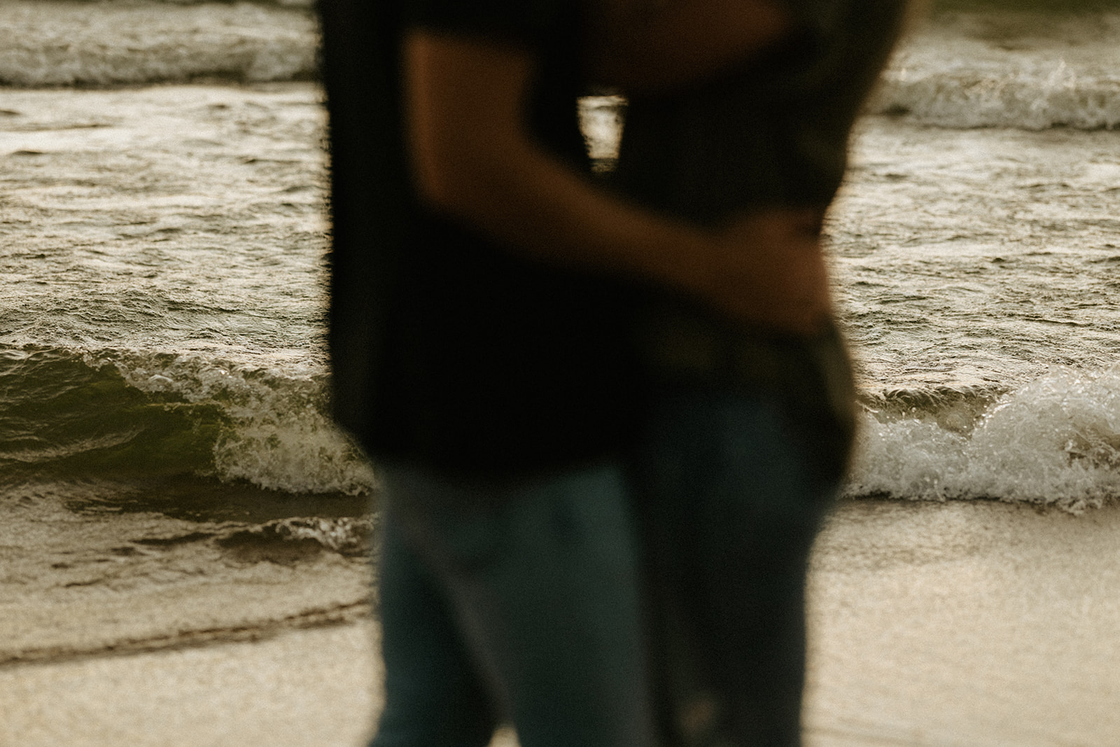 A couple hugging at Saugatuck Dunes State Park in Michigan