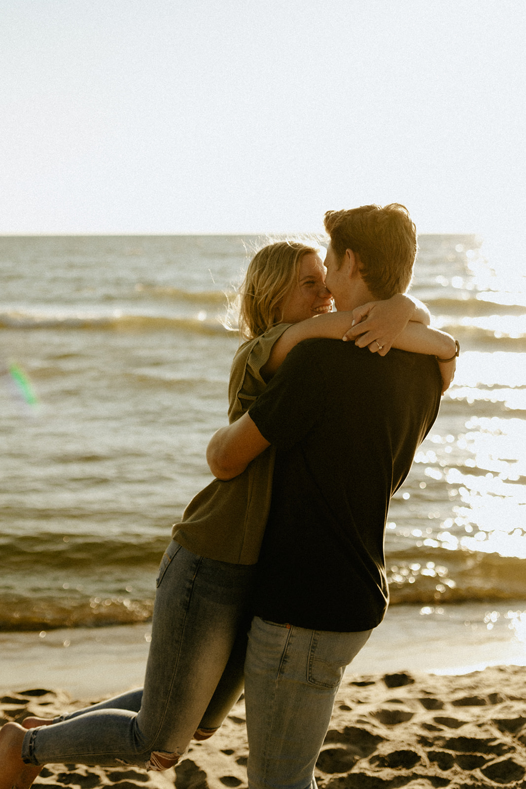 A couple hugging at Saugatuck Dunes State Park in Michigan