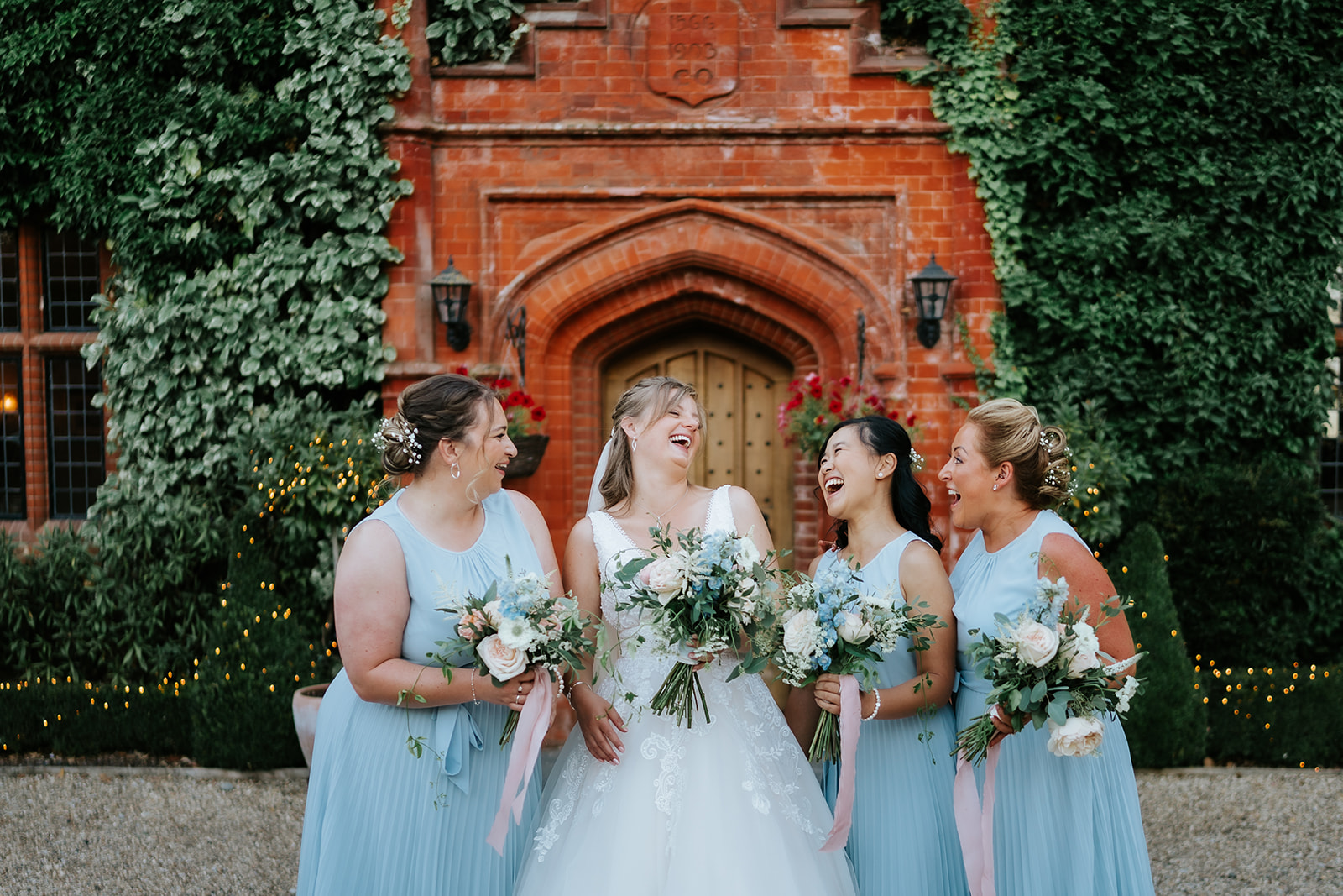 Bridal party outside Woodhall Manor wedding venue