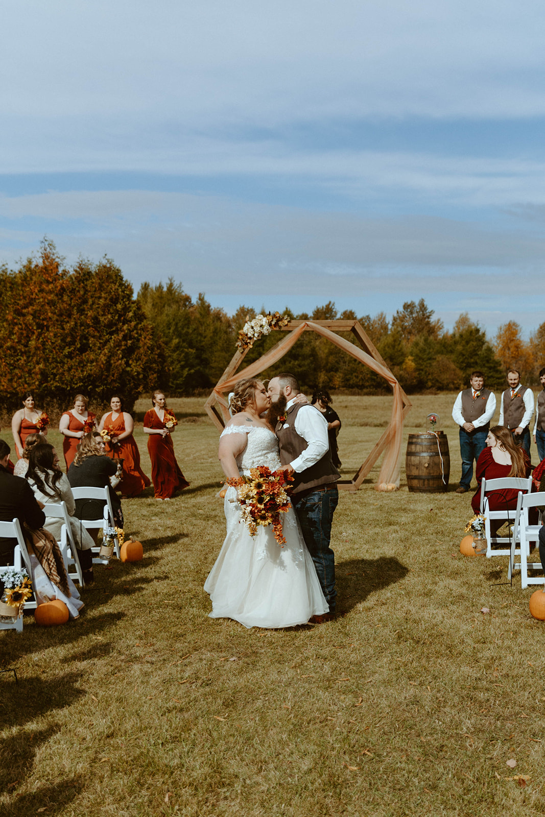 First kiss as husband and wife during fall wedding in Escanaba.